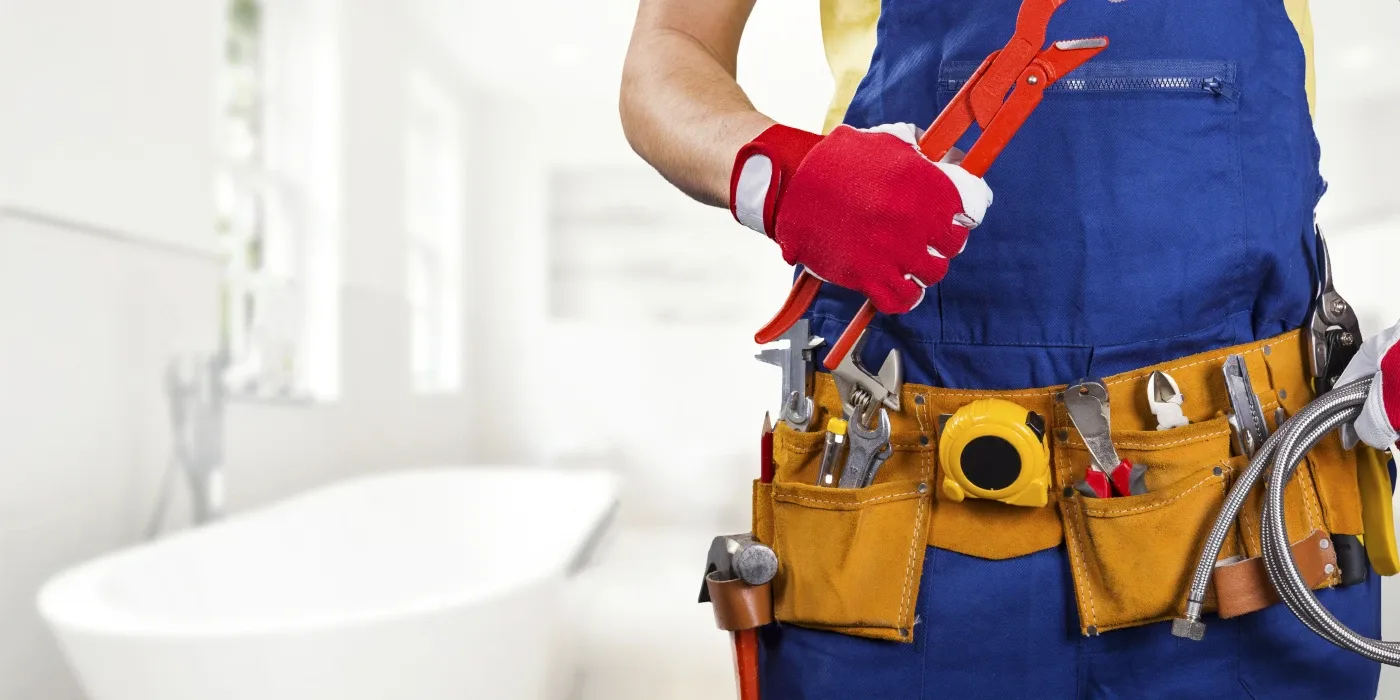 The torso of plumbing technician showing a tool belt from Houston Plumbing Repair in Sugar Land, TX - Sugar Land TX